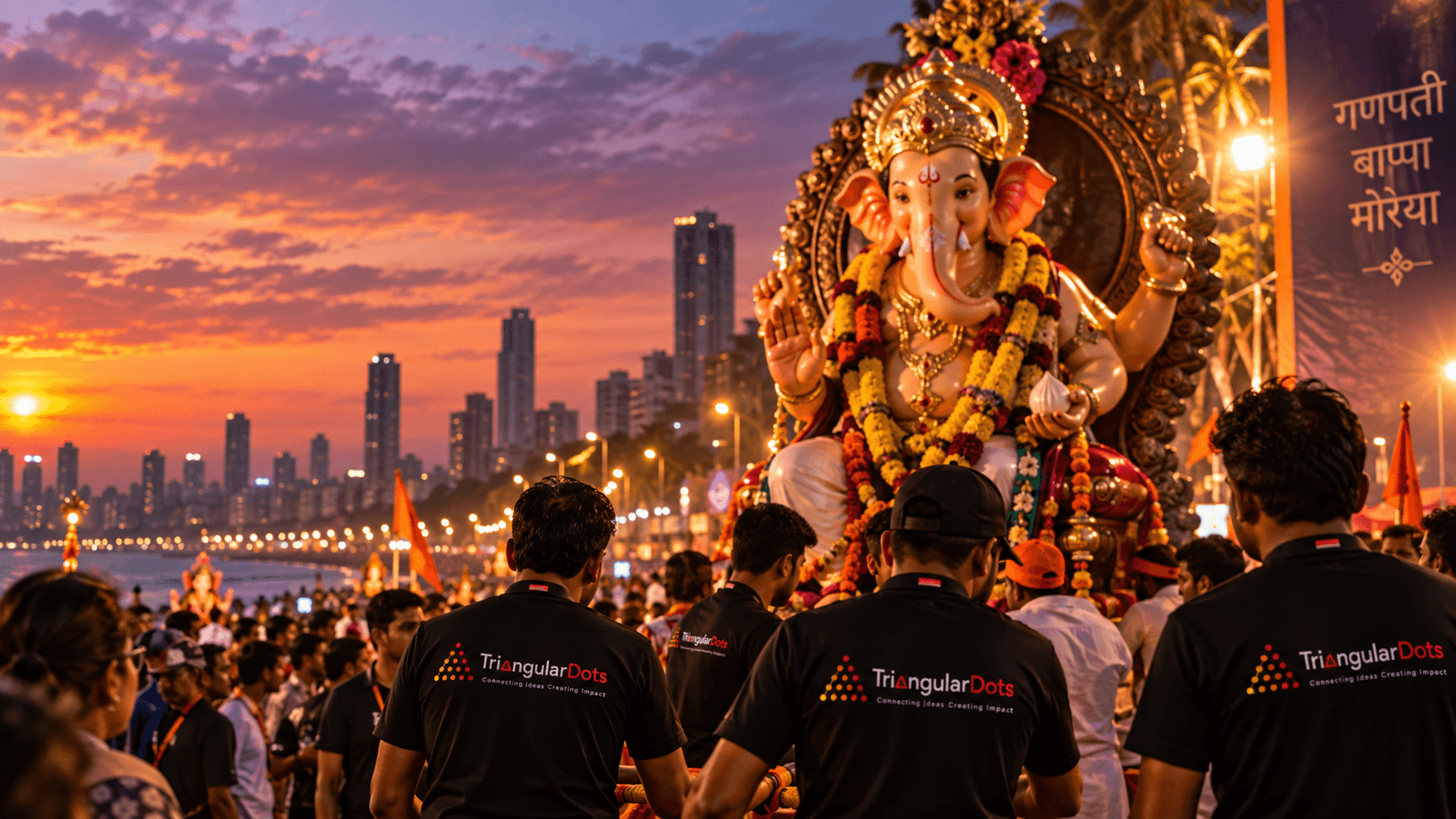Ganesh Chaturthi celebration at sunset with a Ganesh idol, crowds and event teams against the Mumbai skyline